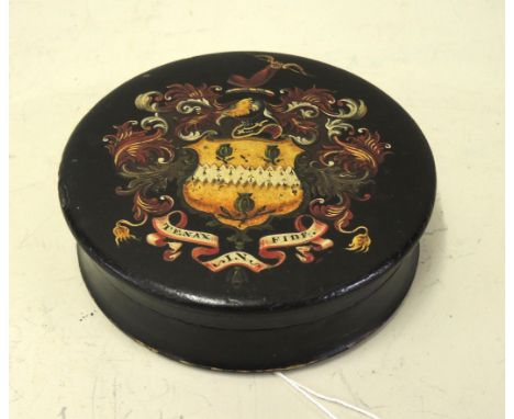 19th Century or early 20th Century circular paper mache snuff box, decorated with a Armorial crest in colours and gilt, 12cm 