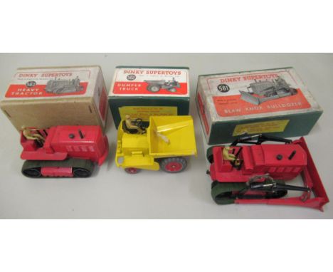 Dinky Supertoys Blaw Knox bulldozer no. 561, a dumper truck no. 562 and a heavy tractor no. 563, all in original boxes 