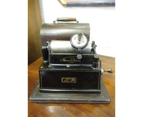 Edison Gem Model C phonograph in fitted case (missing horn)It is original. No obvious signs of woodworm. 