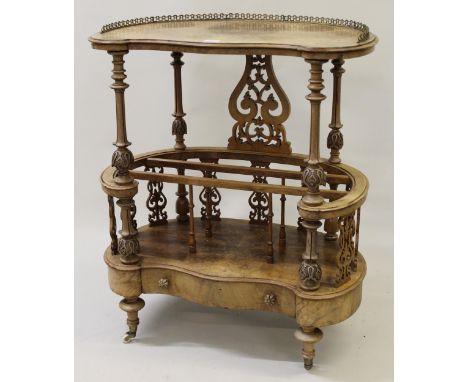 Victorian figured walnut Canterbury whatnot, the kidney shaped top above a three division base with drawer, on turned support