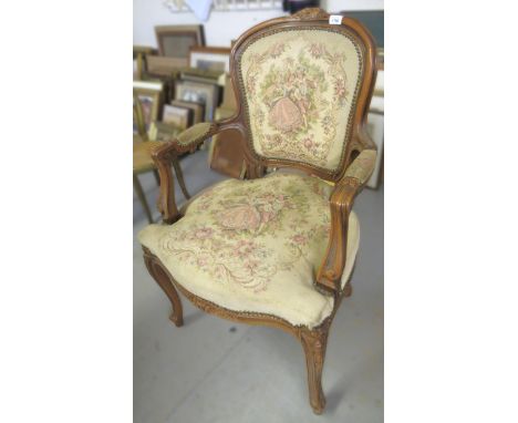 French open elbow chair with floral carved surmount and tapestry style upholstery, on cabriole supports 