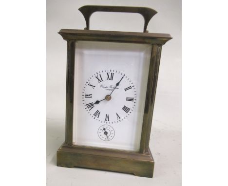 20th Century brass cased carriage clock, the white enamel dial with Roman numerals and subsidiary alarm dial, signed Charles 