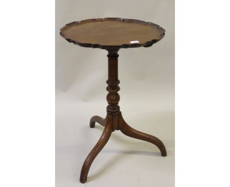Small 19th Century mahogany tilt top pedestal table, the moulded pie crust shaped top above a turned column support and tripo