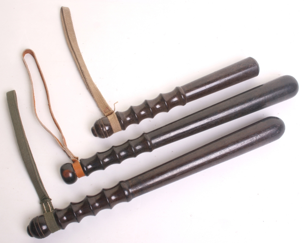 Three Vintage Ebonised Police Truncheons, Turned wooden truncheons with
