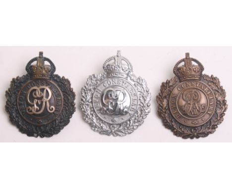 Three Kings Crown Devon Constabulary Helmet badges, black on brass wreath EVII centre, black wreath two piece badge with whit