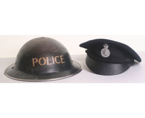 Police WWII Steel Helmet and North Riding Constabulary Kings crown peak cap dated 1947, both in fair to good used condition (