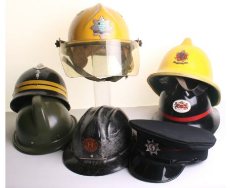 Selection of Fire Service Headdress consisting of Peterborough Volunteer Fire Brigade helmet with transfer decal to the front