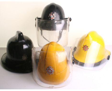 Scarce Circa 1960’s Board of Trade Fire Fighters Helmet, of black leather with pull down visor shield. Remains of the origina