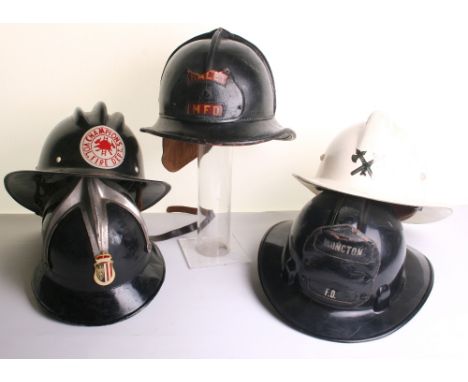 Selection of Fire Fighters Helmets consisting of early American leather example with damaged leather badge to the front, inte