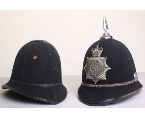 Two Cork Type Police Helmets, six panel rose top helmet, no badge and Queens crown Bermuda Police helmet, chrome band, two si