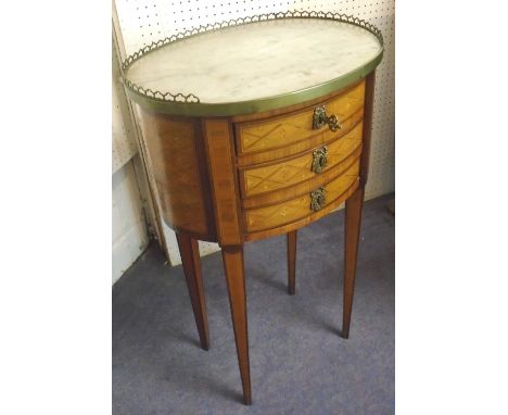 PETITE COMMODE, early 19th century French kingwood, parquetry and brass mounted, of compact proportions, the oval marble top 