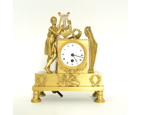 MANTEL TIMEPIECE, 19th century, French, the ormolu case with harp and figure playing a lyre, silk suspension, 20.5cm H overal