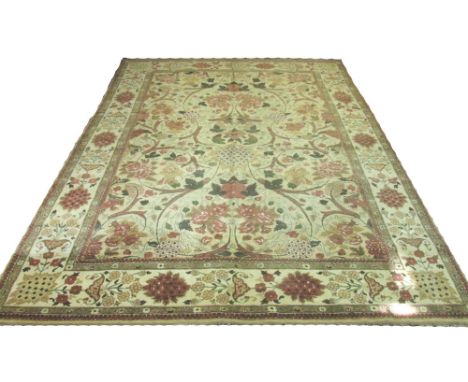 AGRA VOYSEY DESIGN CARPET, 370cm x 270cm, stylised botanical all over design, on an ivory field within corresponding bands an