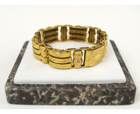 GOLD GATE BRACELET, circa 1940's, of Middle Eastern origin with engraved decoration, 38g. 