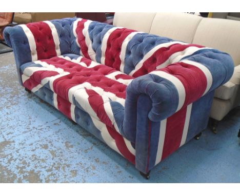 ANDREW MARTIN CHESTERFIELD SOFA, Union Flag design, in velvet buttoned finish, on bun supports with castors, 220cm long. 