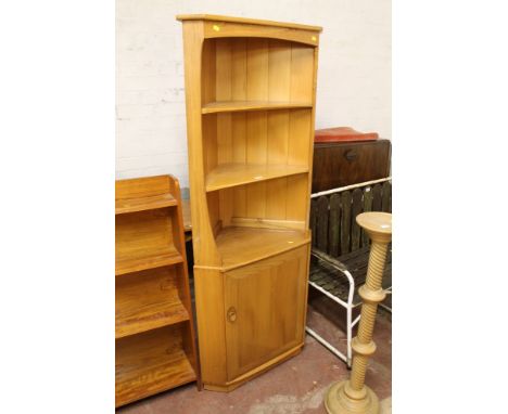 AN ERCOL CORNER CUPBOARD 