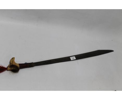 A BORNEO DAYAK HEAD HUNTERS TYPE SWORD, no scabbard, carved bound handle with leather bound grip. Length 78 cm.