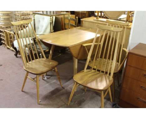 A RETRO ERCOL DROP LEAF DINING ROOM TABLE AND THREE ERCOL CHAIRS 