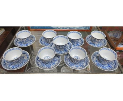 SET OF NINE ORIENTAL BLUE AND WHITE CERAMIC TEA BOWLS AND SAUCERS 