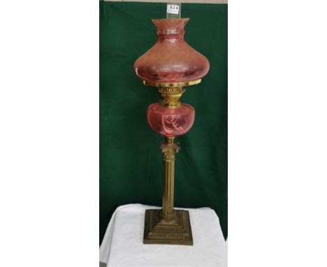Early 20th C brass Oil Lamp with cranberry colour glass shade &amp; reservoir, Corinthian column, 75cm h