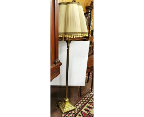 Brass Corinthian column electric Standard Lamp on stepped square base, fluted shade