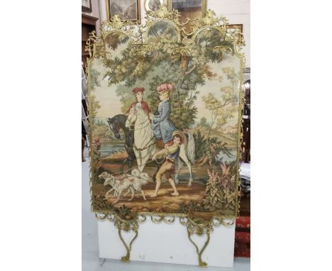 Brass framed floor standing machine woven tapestry of figures on horseback mounted with gilt metal coat hooks, 72" h x 42" w