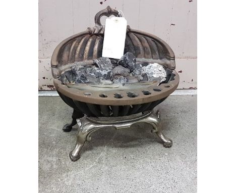A small cast iron fire grate and a beetle shaped boot rack (2) 