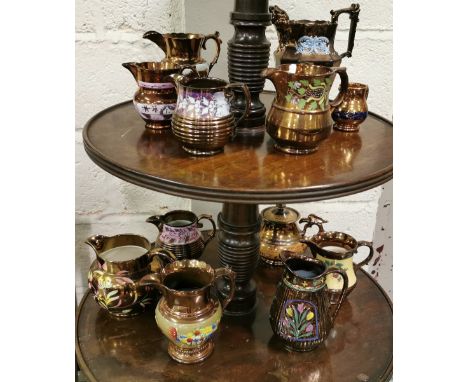 13 Pieces of Brown Lustre Ware including Jugs of various sizes and 1 teapot, colourful patterns 