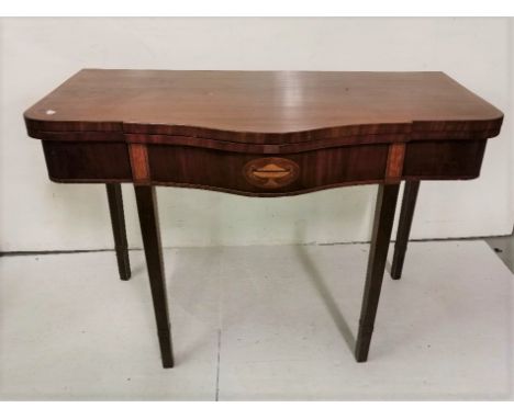 A large Inlaid Mahogany Foldover Card Table, with a serpentine front over tapered legs, with a green baize insert, 110cm w x 