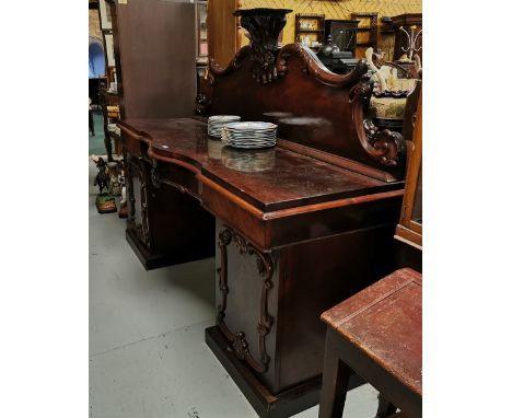 William IV Mahogany Sideboard, the decorative gallery featuring leaf and floral designs and a display shelf, above a bowed fr