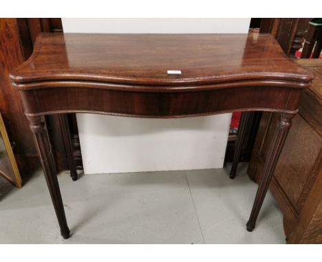 19thC Mahogany line inlaid serpentine fronted fold-over Card Table on turned tapering reeded supports, 29" h x 36" w x 18" d