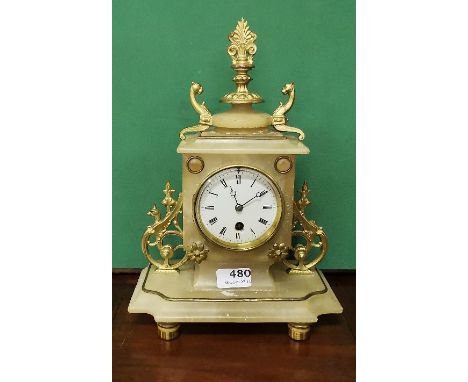 French Onyx Timepiece Mantle clock with scrolled side mounts and brass toes, 35cm h x 25cm w