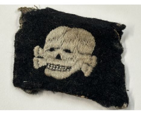 WW2 Third Reich SS Totenkopfverbande rare early pattern collar tab with left facing skull. This item was obtain by a British 