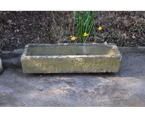 
	
		A carved sandstone or limestone garden trough or basin, 18th or 19th century, of rustic rectangular form, 23cm high, 120