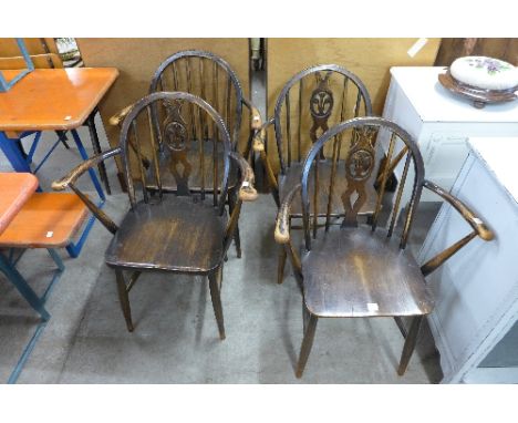 A set of three Ercol chairs and one other