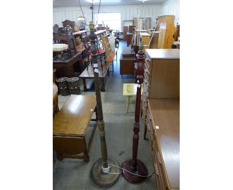 A beech standard lamp and a mahogany standard lamp