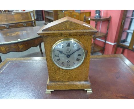 A World War II R.A.F. oak fusee mantel clock, the movement marked C.M.C., H8060, 1937