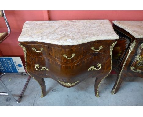 A reproduction Louis XV style mahogany effect marble topped commode