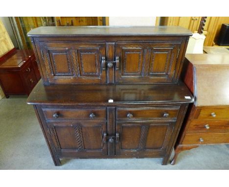 An Ercol court cupboard