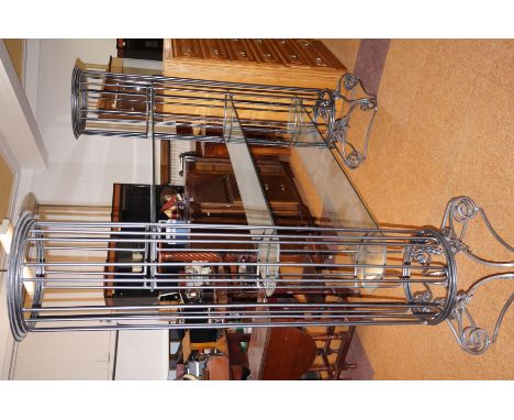 Tempered glass shelf of large proportion, with wrought iron columns