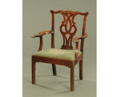 A Georgian mahogany armchair, Chippendale style with pierced splat back drop in seat and raised on chamfered legs.  Height to