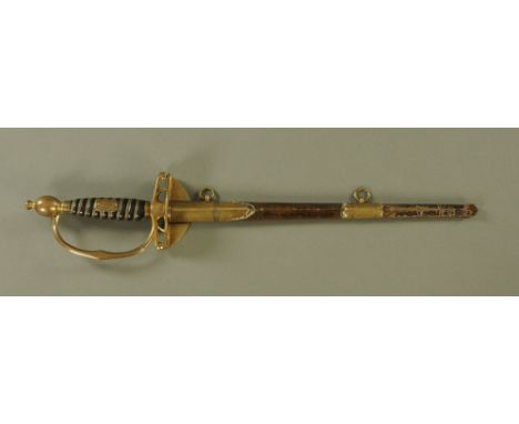 A Victorian Naval Officers Dress Sword by Fiske, Portsmouth, with gilded hilt, wire bound grip and with brass mounted leather