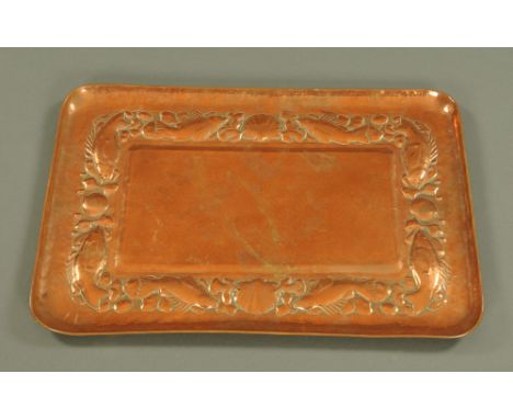 A Newlyn copper tray embossed with shells and fish, stamped Newlyn.  63 cm x 43 cm.