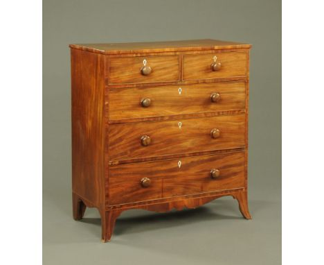 A 19th century mahogany chest of drawers, two short over three long with wooden knob handles and cock beading to each drawer 