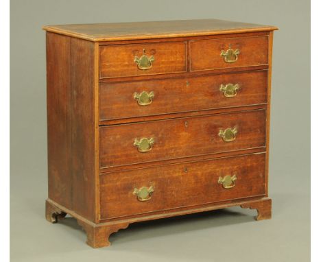 A George III oak chest of drawers, with replacement brass swan neck handles on bracket feet.  97 cm high, 100 cm wide, 54 cm 
