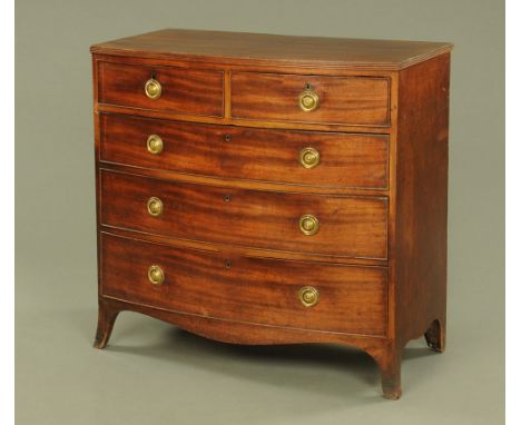 An early 19th century mahogany bow fronted chest of drawers, with applied moulded edge above two short and three long graduat