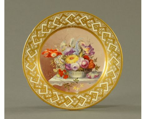 An early 19th century Pinxton porcelain circular cabinet plate, finely enamelled in colours with a vase of flowers to centre 