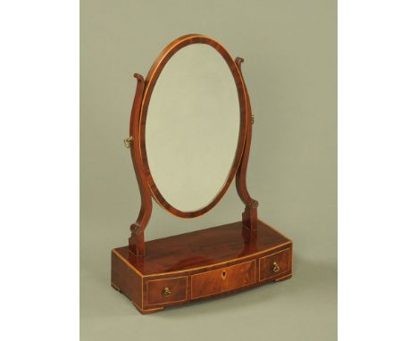 A 19th century inlaid mahogany oval dressing table mirror, the base fitted with three drawers and raised on short bracket fee