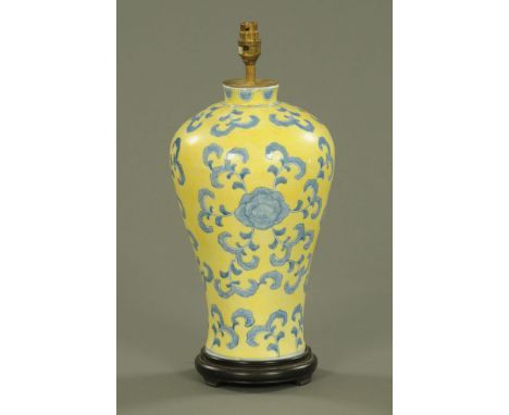 A Chinese blue, white and yellow vase form table lamp.  Height excluding light fitting 42 cm.