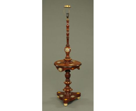 An early 20th century mahogany lamp standard, decorated with Sevres style porcelain plaques and profile cameos.  Height exclu